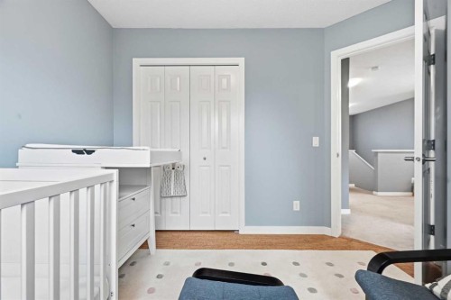 14 River Heights Crescent, Cochrane, AB - Indoor Photo Showing Bedroom