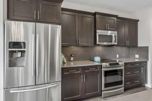 11 Legacy Crescent Se, Calgary, AB - Indoor Photo Showing Kitchen With Stainless Steel Kitchen With Upgraded Kitchen