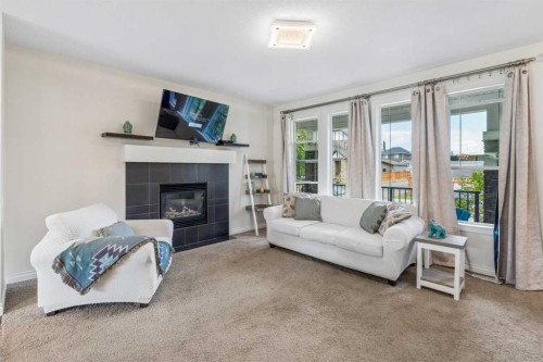 11 Legacy Crescent Se, Calgary, AB - Indoor Photo Showing Living Room With Fireplace