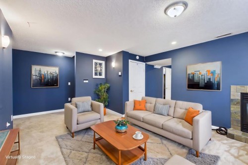 27 Bridlewood Park Sw, Calgary, AB - Indoor Photo Showing Living Room With Fireplace