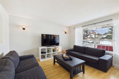 27 Bridlewood Park Sw, Calgary, AB - Indoor Photo Showing Living Room