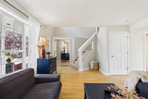 27 Bridlewood Park Sw, Calgary, AB - Indoor Photo Showing Living Room