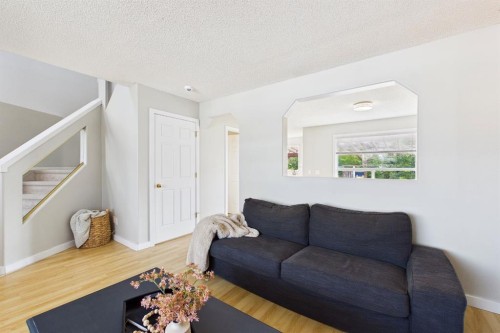 27 Bridlewood Park Sw, Calgary, AB - Indoor Photo Showing Living Room