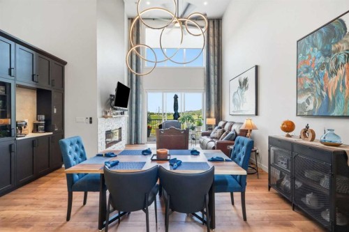 77 Wolf Hollow Villas Se, Calgary, AB - Indoor Photo Showing Dining Room With Fireplace