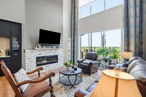 77 Wolf Hollow Villas Se, Calgary, AB - Indoor Photo Showing Living Room With Fireplace