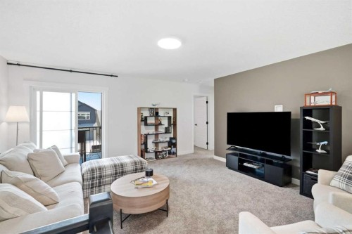 77 Wolf Hollow Villas Se, Calgary, AB - Indoor Photo Showing Living Room