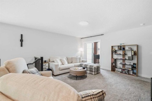 77 Wolf Hollow Villas Se, Calgary, AB - Indoor Photo Showing Living Room