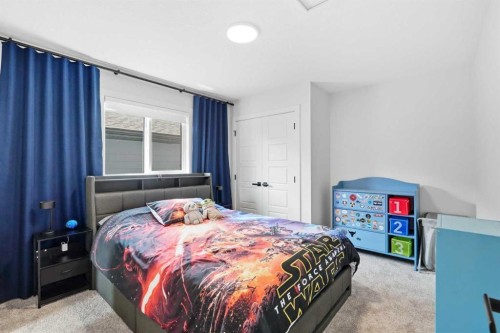77 Wolf Hollow Villas Se, Calgary, AB - Indoor Photo Showing Bedroom