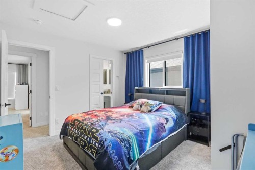 77 Wolf Hollow Villas Se, Calgary, AB - Indoor Photo Showing Bedroom