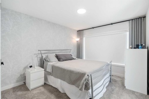 77 Wolf Hollow Villas Se, Calgary, AB - Indoor Photo Showing Bedroom