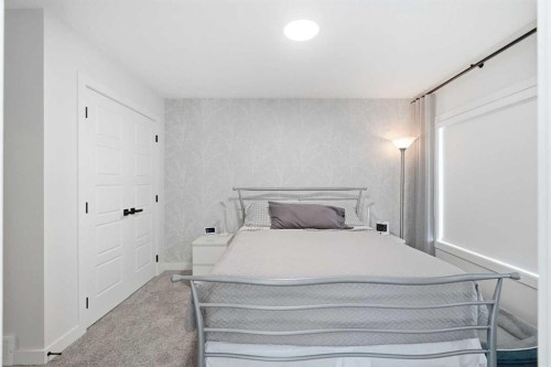 77 Wolf Hollow Villas Se, Calgary, AB - Indoor Photo Showing Bedroom