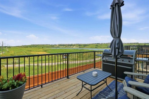 77 Wolf Hollow Villas Se, Calgary, AB - Outdoor With Deck Patio Veranda With View