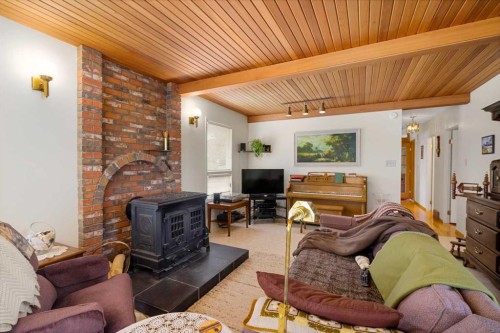 40 Thornlee Crescent Nw, Calgary, AB - Indoor Photo Showing Living Room With Fireplace