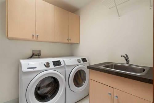 8 Coulee Park Sw, Calgary, AB - Indoor Photo Showing Laundry Room
