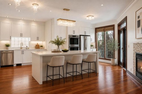 8 Coulee Park Sw, Calgary, AB - Indoor Photo Showing Kitchen With Fireplace With Upgraded Kitchen
