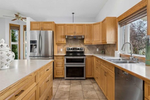 246 Mt Lorette Place Se, Calgary, AB - Indoor Photo Showing Kitchen With Double Sink