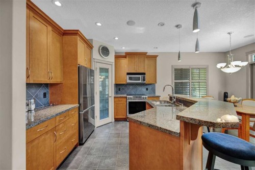 146 Springborough Point Sw, Calgary, AB - Indoor Photo Showing Kitchen With Double Sink With Upgraded Kitchen