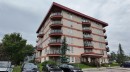 1103-105 Railway Avenue Sw, Airdrie, AB  - Outdoor With Facade 