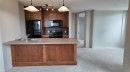 1103-105 Railway Avenue Sw, Airdrie, AB  - Indoor Photo Showing Kitchen With Double Sink 