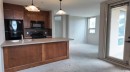 1103-105 Railway Avenue Sw, Airdrie, AB  - Indoor Photo Showing Kitchen With Double Sink 