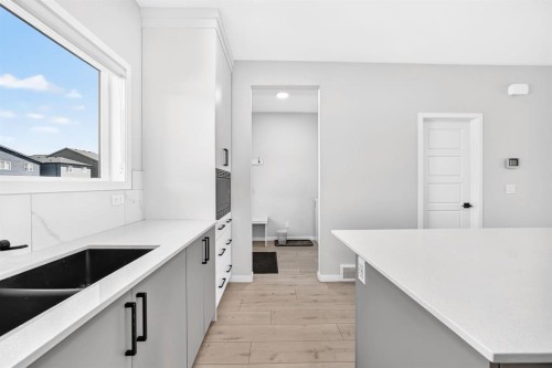 20 Corner Glen Avenue Ne, Calgary, AB - Indoor Photo Showing Kitchen With Double Sink