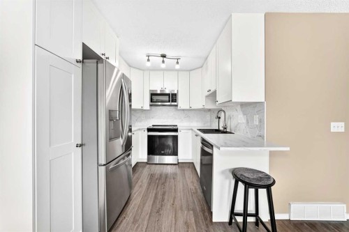 108 Douglas Glen Park Se, Calgary, AB - Indoor Photo Showing Kitchen With Stainless Steel Kitchen With Upgraded Kitchen