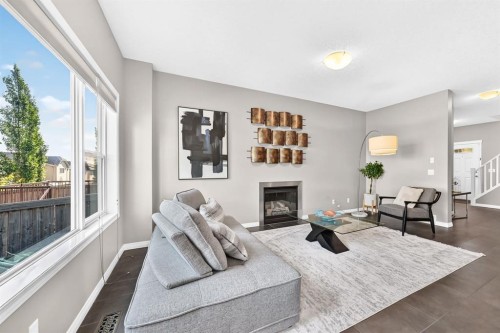 325 Kincora Glen Rise Nw, Calgary, AB - Indoor Photo Showing Living Room With Fireplace