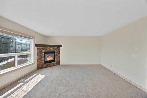 130 Panamount Road Nw, Calgary, AB - Indoor Photo Showing Other Room With Fireplace