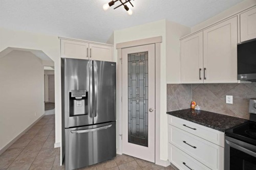 130 Panamount Road Nw, Calgary, AB - Indoor Photo Showing Kitchen With Stainless Steel Kitchen
