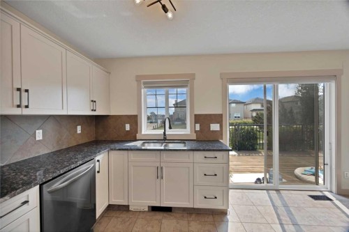 130 Panamount Road Nw, Calgary, AB - Indoor Photo Showing Kitchen With Double Sink