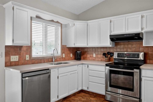 105 Riverview Court Se, Calgary, AB - Indoor Photo Showing Kitchen With Double Sink