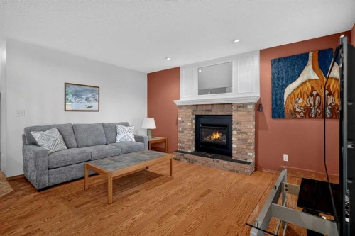 105 Riverview Court Se, Calgary, AB - Indoor Photo Showing Living Room With Fireplace