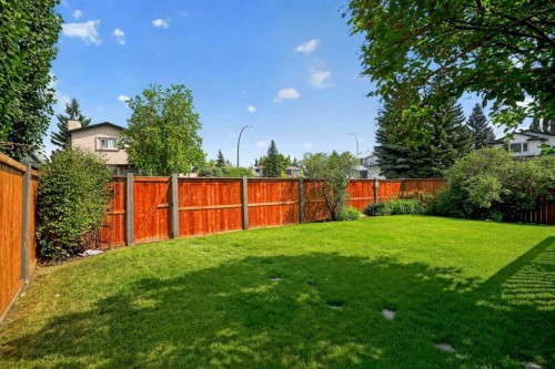 105 Riverview Court Se, Calgary, AB - Outdoor With Backyard