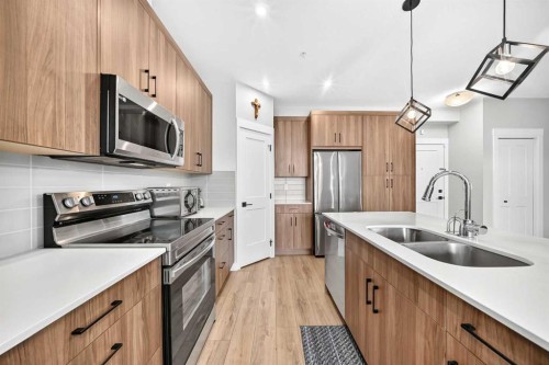6106-200 Seton Circle Se, Calgary, AB - Indoor Photo Showing Kitchen With Double Sink With Upgraded Kitchen
