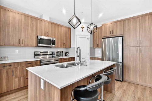 6106-200 Seton Circle Se, Calgary, AB - Indoor Photo Showing Kitchen With Double Sink With Upgraded Kitchen