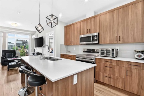 6106-200 Seton Circle Se, Calgary, AB - Indoor Photo Showing Kitchen With Double Sink