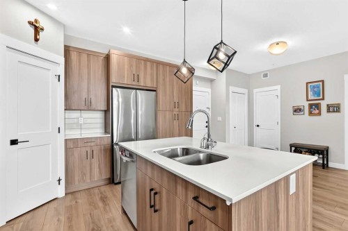 6106-200 Seton Circle Se, Calgary, AB - Indoor Photo Showing Kitchen With Double Sink With Upgraded Kitchen