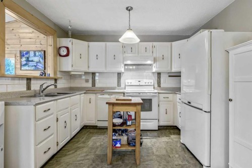 216 B Royal, Diamond Valley, AB - Indoor Photo Showing Kitchen With Double Sink