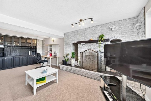 1823 65 Street Ne, Calgary, AB - Indoor Photo Showing Other Room With Fireplace