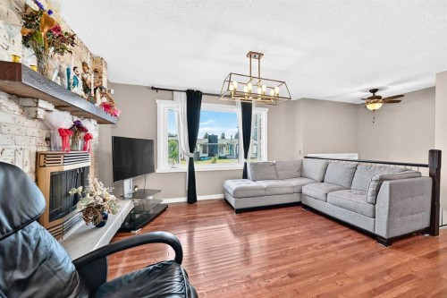 1823 65 Street Ne, Calgary, AB - Indoor Photo Showing Living Room With Fireplace