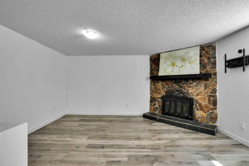 1015 Maitland Way Ne, Calgary, AB - Indoor With Fireplace