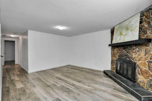 1015 Maitland Way Ne, Calgary, AB - Indoor With Fireplace