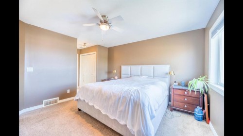 8 Logan Court, Sylvan Lake, AB - Indoor Photo Showing Bedroom