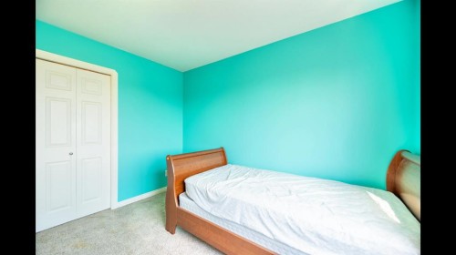 8 Logan Court, Sylvan Lake, AB - Indoor Photo Showing Bedroom