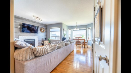 8 Logan Court, Sylvan Lake, AB - Indoor Photo Showing Living Room With Fireplace