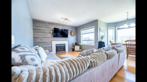 8 Logan Court, Sylvan Lake, AB - Indoor Photo Showing Living Room With Fireplace