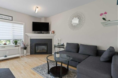 604 7 Street Nw, High River, AB - Indoor Photo Showing Living Room With Fireplace