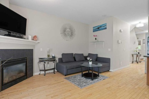 604 7 Street Nw, High River, AB - Indoor Photo Showing Living Room With Fireplace