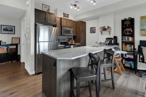 205-250 Fireside View, Cochrane, AB - Indoor Photo Showing Kitchen With Stainless Steel Kitchen