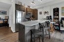 205-250 Fireside View, Cochrane, AB  - Indoor Photo Showing Kitchen With Stainless Steel Kitchen 
